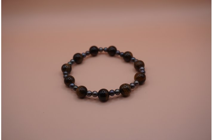 armb�nd med gr�/brune perler